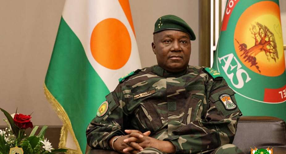 The head of the Nigerien junta, General Abdourahamane Tiani, looks on as he welcomes Beninese President Romuald Wadagni during the first leg of a visit to Niger and Burkina Faso, in Niamey, Niger 2 June 2026. - via REUTERS - Niger Presidency