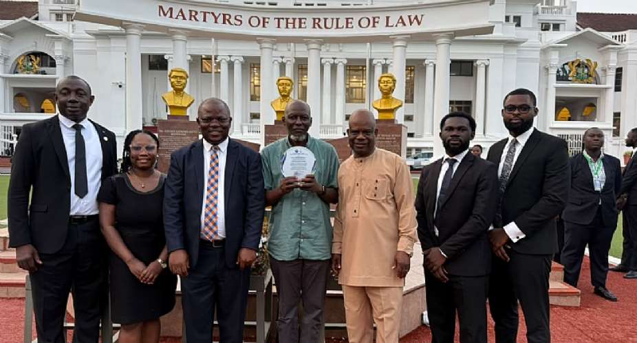 Zenith University College Law Faculty members and the team displaying the award