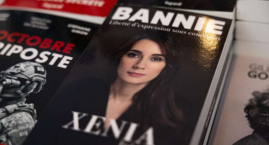 This photograph shows the book of Xenia Fedorova (C), the former director of the French version of the Russian state-run channel RT, which was banned in France after the Russian invasion of Ukraine. -  Xavier Galiana, AFP