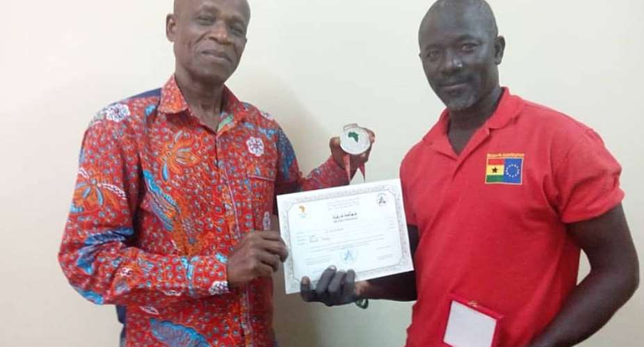 Beach Volleyball Coach Mumuni Presents Medal And Certificate To President Of Ghana Volleyball Association