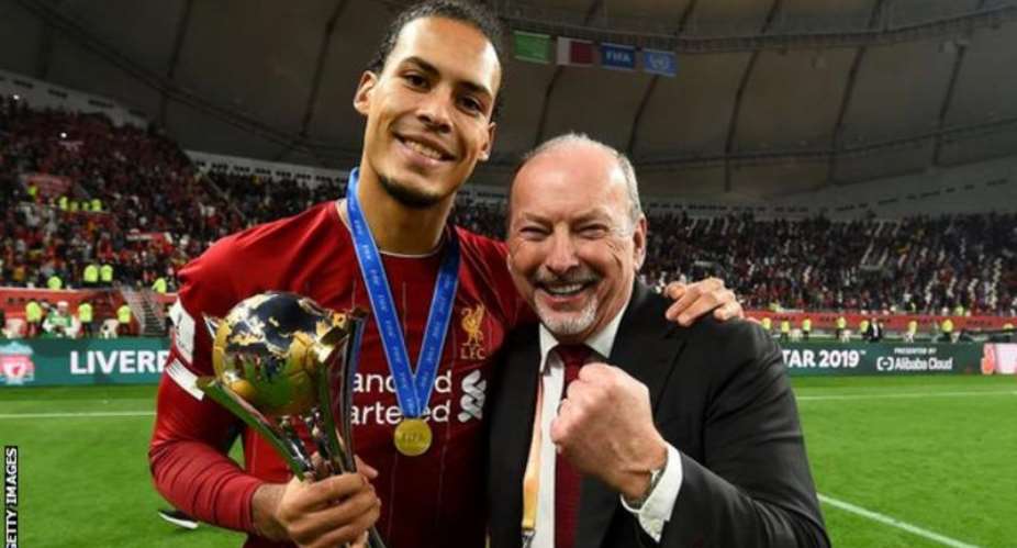Moore right celebrates with defender Virgil van Dijk after the Fifa Club World Cup win over Flamengo in December