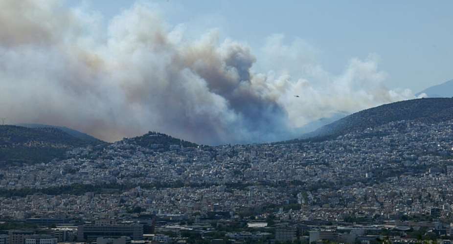 Smoke from a wildfire burning near Haidari blankets Athens, Greece on July 31, 2026. -  Louiza Vradi, Reuters