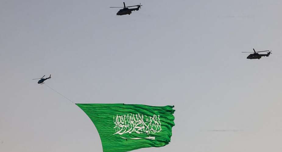 Royal Saudi Air Force helicopters fly over during an airshow marking Saudi Arabias 95th National Day celebrations in Banban at the edges of Riyadh on September 23, 2025. -  Fayez Nureldine, AFP