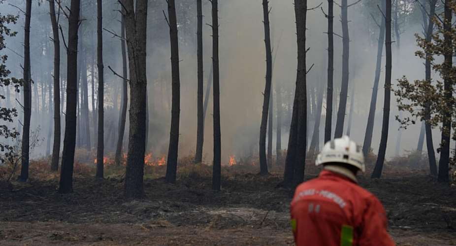 A firefighter works to extinguish a fire, near Blagon, southwestern France, Friday on July 31, 2026. -  Baz Ratner, AP Photo