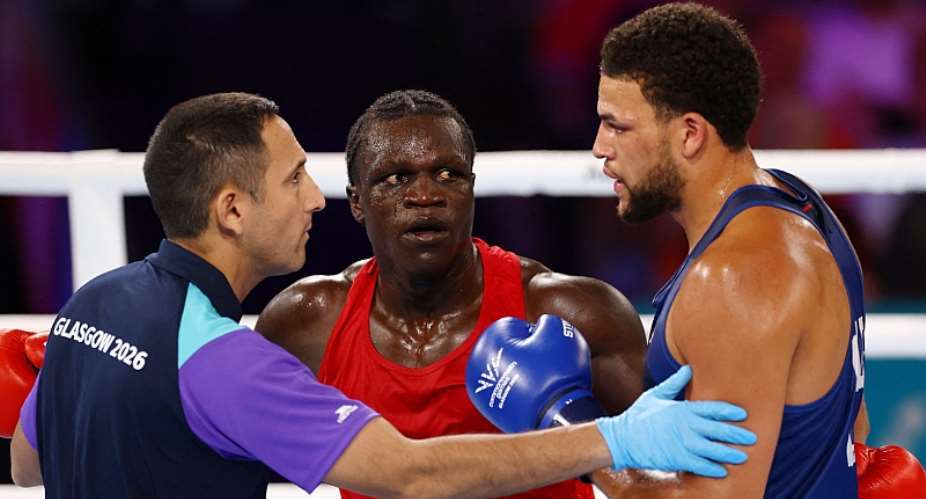 ReutersImage caption: Aziz Abdul (centre) was disqualified early in the third round of his fight against Damar Thomas (right)