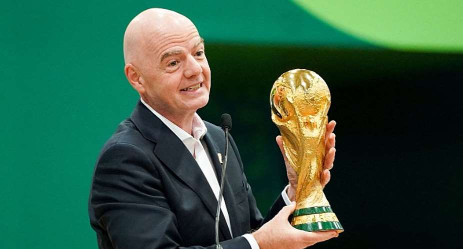 FIFA president Gianni Infantino with the World Cup trophy. Pic: Reuters
