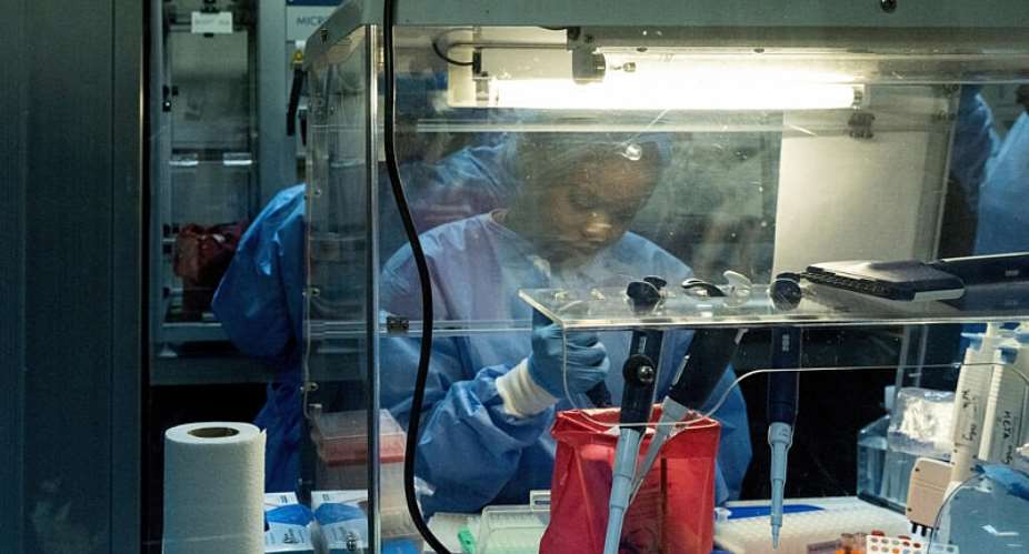 Employees at the National Institute of Biomedical Research in Kinshasa, Democratic Republic of the Congo, 2 July. -  Arsene Mpiana / REUTERS