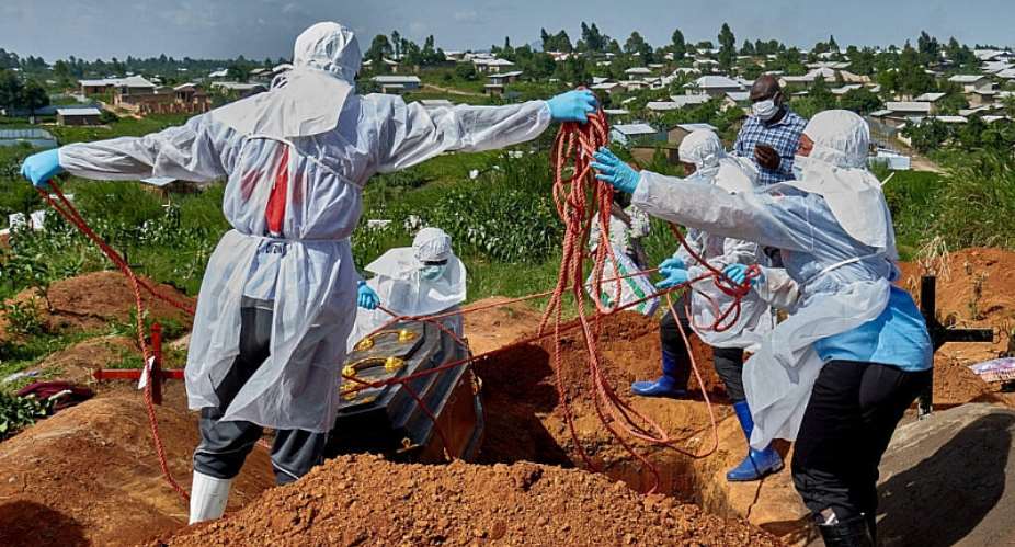 Red Cross workers lower the coffin of Dr. Tibenderana Katho Blaise who worked at the Centre Medical Evangelique (CME) in Hoho commune and died of Ebola virus, in Bunia town, Ituri province, Democratic Republic of Congo, 26 May 2026. -  Gradel Muyisa Mumbere, Reuters