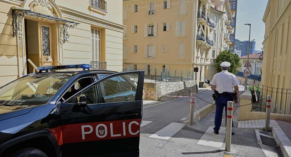 A police officer stands guard in a street in Monaco on Tuesday, 30 June, a day after an explosive device seriously injured three people at a residential building. -  Philippe Magoni / AP
