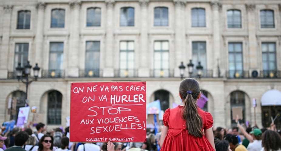 A protester holds a placard reading We wont just shout; well scream. Stop sexual violence during a demonstration at Place Vendome outside the French Justice Ministry in Paris on June 29, 2026. -  Julie Sebadelha, AFP