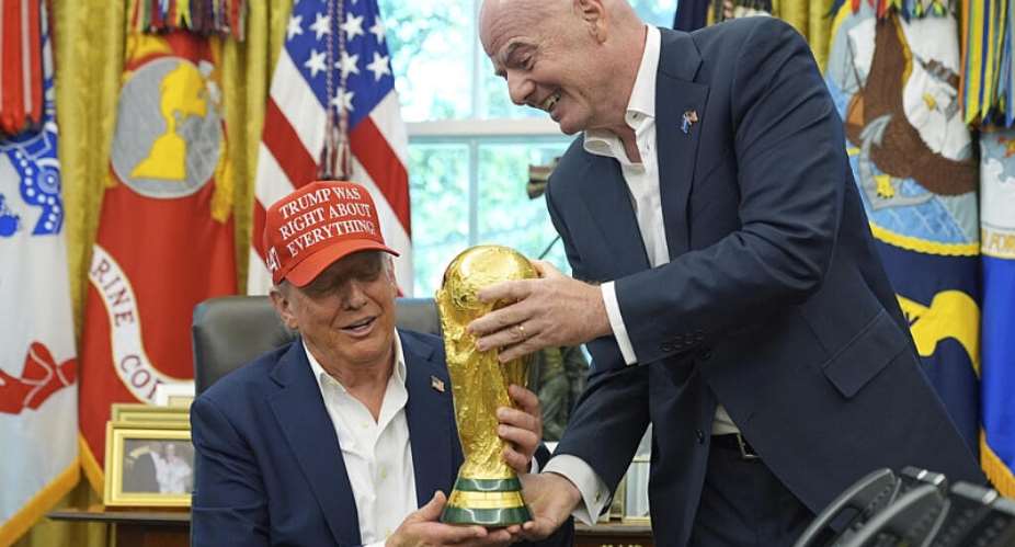 FIFA President Gianni Infantino hands the FIFA World Cup Winners Trophy to President Donald Trump, White House, August 22, 2025 -  Jacquelyn Martin, AP