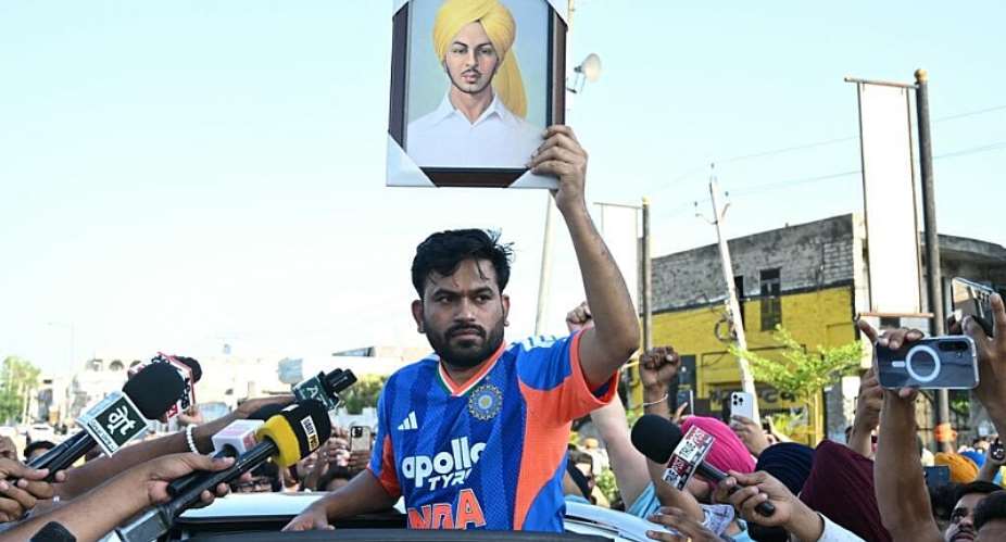 Abhijeet Dipke, founder of the Cockroach Janata Party, holds a portrait of anti-colonial revolutionary Shaheed Bhagat Singh at a protest in Amritsar against alleged irregularities in Indias national entrance exams on 13 June. - AFP - NARINDER NANU