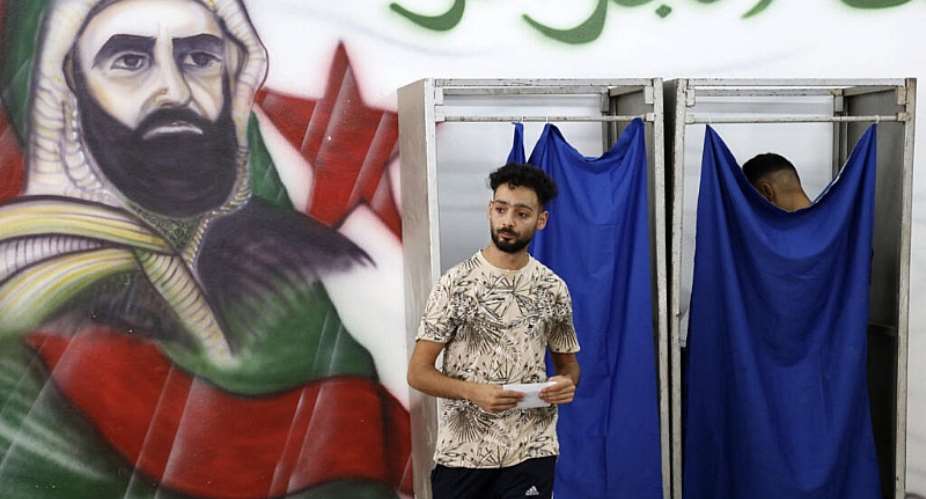 A man prepares to cast his ballot at a polling station during parliamentary elections in Algiers on July 2, 2026. -  AFP