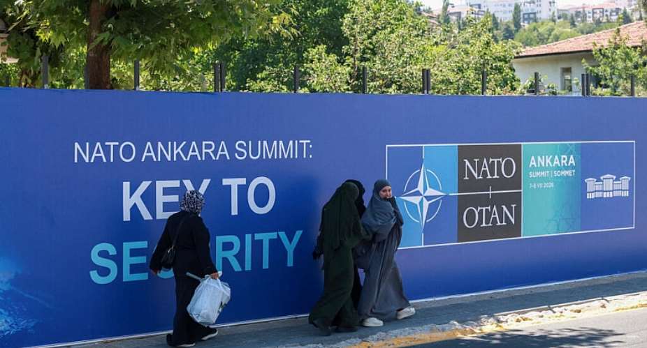 People walk past billboards built for upcoming NATO summit in Ankara, Turkey, July 1, 2026. -  Efekan Akyuz / Reuters