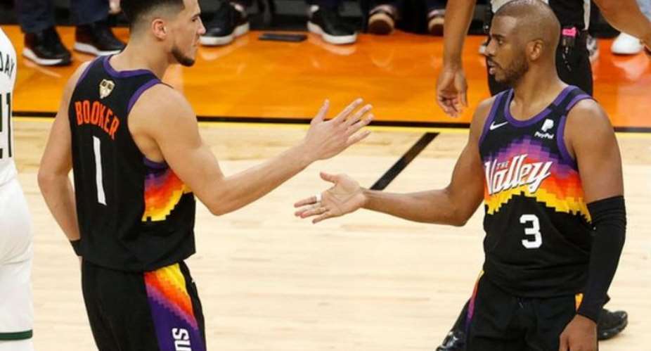 Chris Paul and Devin Booker celebrate for the Phoenix Suns