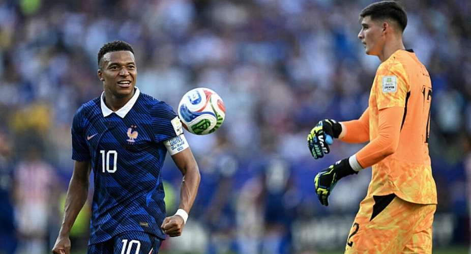 Frances forward Kylian Mbappe celebrates past Paraguays goalkeeper Orlando Gill after winning the 2026 World Cup round of 16 football match between Paraguay and France at the Philadelphia Stadium on July 4, 2026. -  Mauro Pimentel, AFP