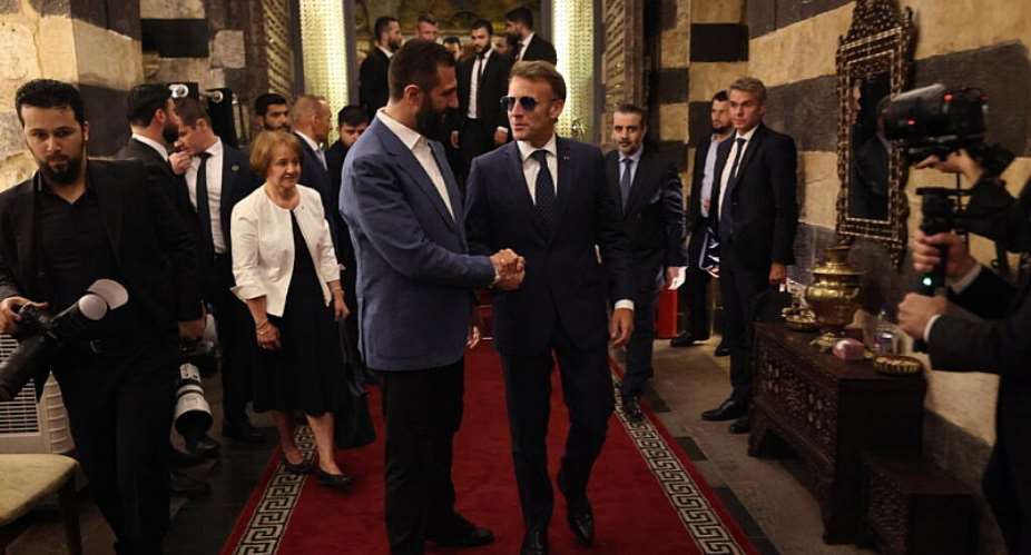 French President Emmanuel Macron (right) and Syrian President Ahmad al-Chareh arrive for dinner at a restaurant in Damascus’s Old City on July 6, 2026. -  Ludovic Marin, AFP