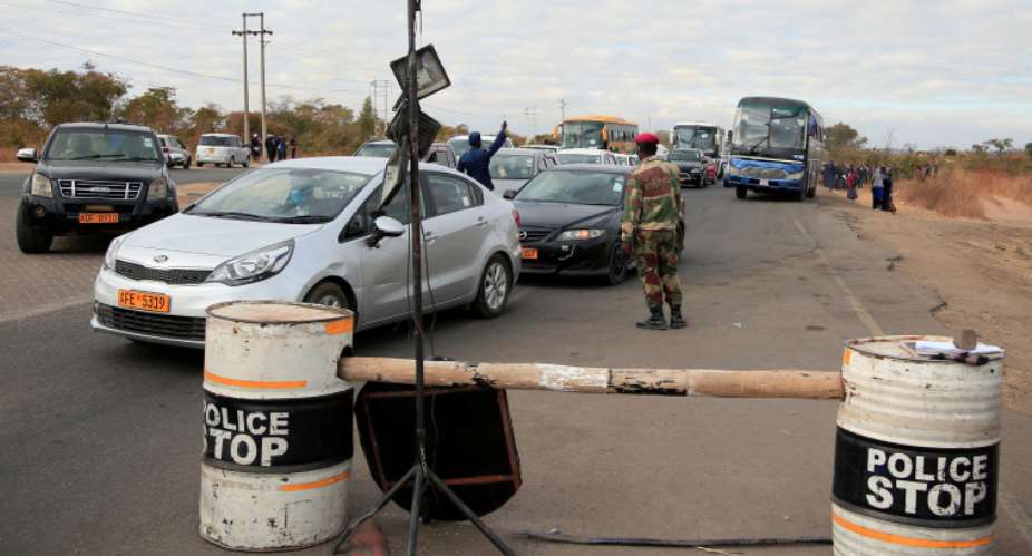 Police and soldiers are seen at a roadblock in Harare, Zimbabwe, on July 24, 2020. CPJ recently joined a letter to UN and AU rapporteurs expressing concern about free expression in the country. ReutersPhilimon Bulawayo