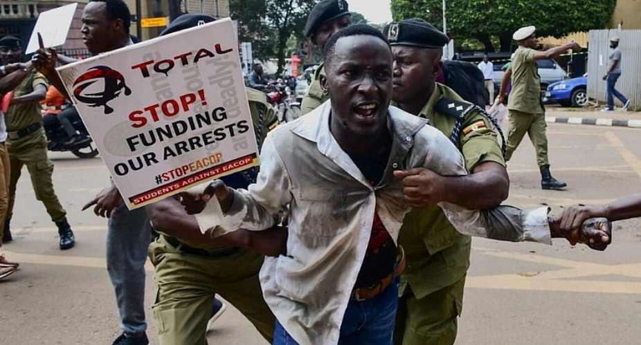 Police apprehend a Ugandan activist during a protest against the East African Crude Oil Pipeline (EACOP) plans in Kampala, Uganda, on 15 September, 2023. -  Reuters