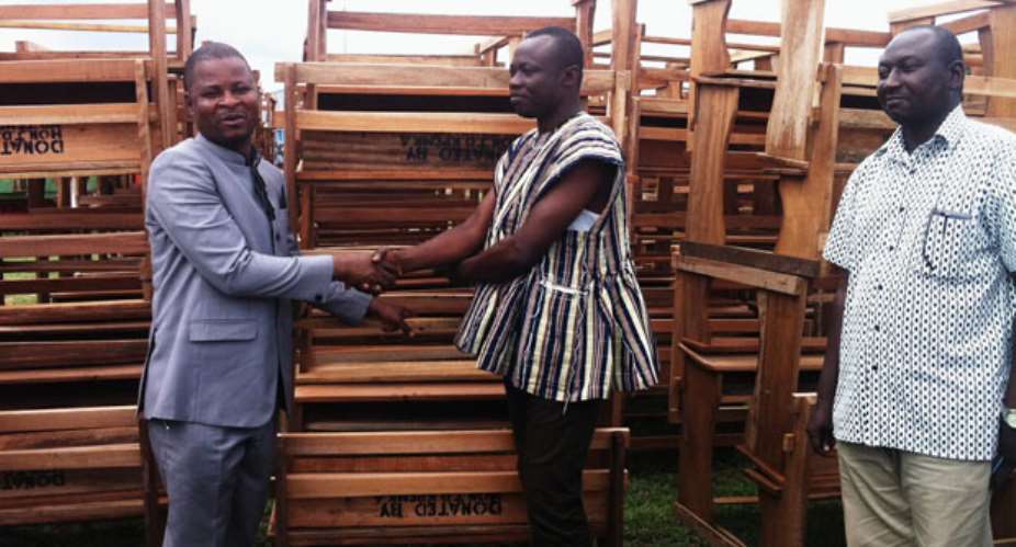 Joseph Dindiok Kpemka handing over dual desks to Emmanuel Avoka