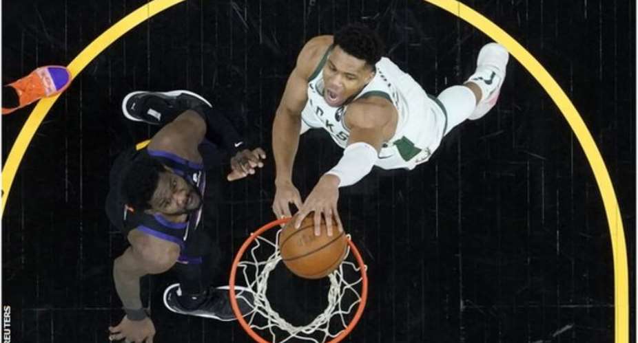 Bucks' Antetokounmpo right returned from a knee injury to score 20 points in the first game of the NBA Finals