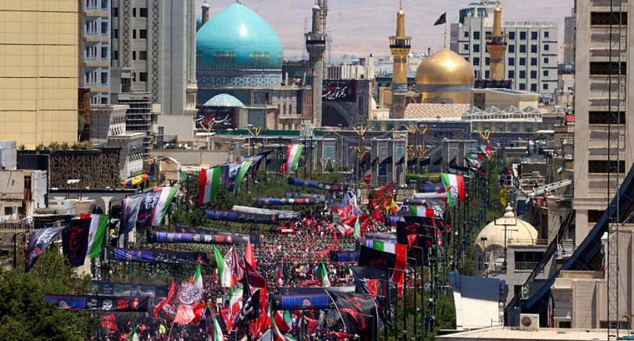 Mourners gather in the street ahead of the funeral of Irans slain supreme leader Ali Khamenei at the Shrine of Imam Reza in Mashhad on July 9, 2026. -  Atta Kenare, AFP