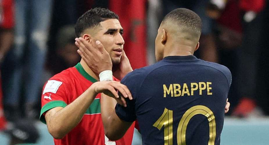 Frances Kylian Mbappe and Moroccos Achraf Hakimi at the end of the 2022 World Cup semi-final football match in Qatar between the two teams, 14 December2022. -  Karim Jaafar/AFP