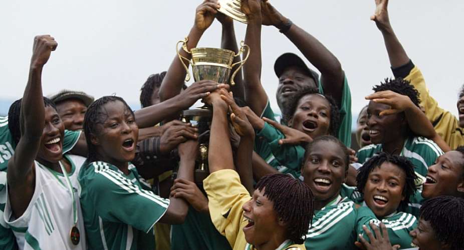Nigeria's Falcons celebrate being African women's champions for the fifth year running, in 2006. - Source: PIUS UTOMI EKPEI/AFP via Getty Images