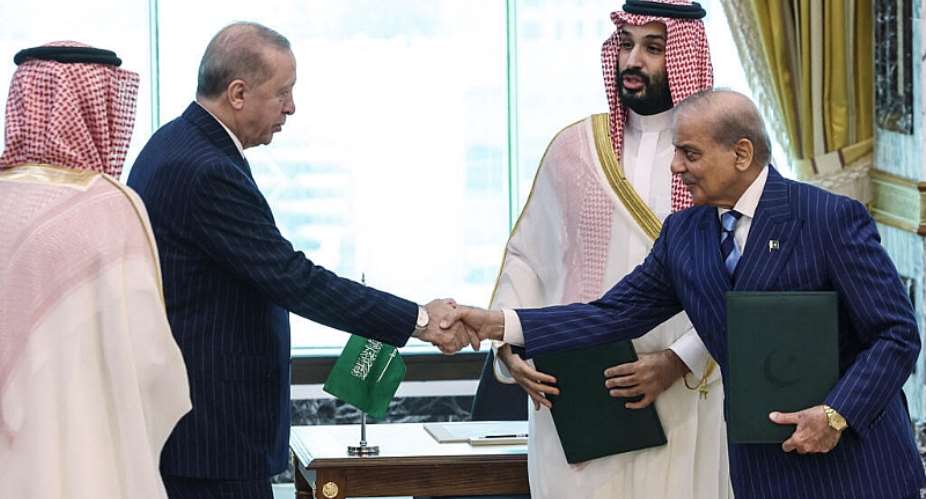 This handout photograph taken and released by the Turkish Presidency press office on August 7, 2026, shows Turkeys President Recep Tayyip Erdogan (L) shaking hands with Pakistans Prime Minister Shehbaz Sharif as Saudi Arabias Crown Prince Mohammed bin Salman (2nd R) looks on after signing a joint defence agreement in Mecca. Saudi Arabia, Turkey and Pakistan signed a joint defence agreement on August 7 amid violence in the region from Houthi attacks and the US-Iran war. -  AFP