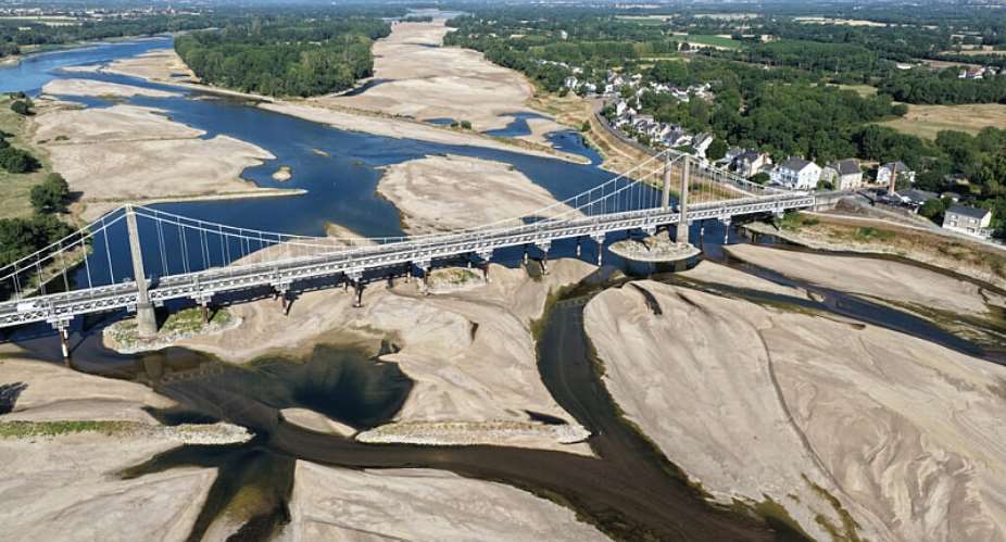 A bridge spans the dried out Loire River in western France on July 10, 2026 -  Damien MEYER / AFP/File