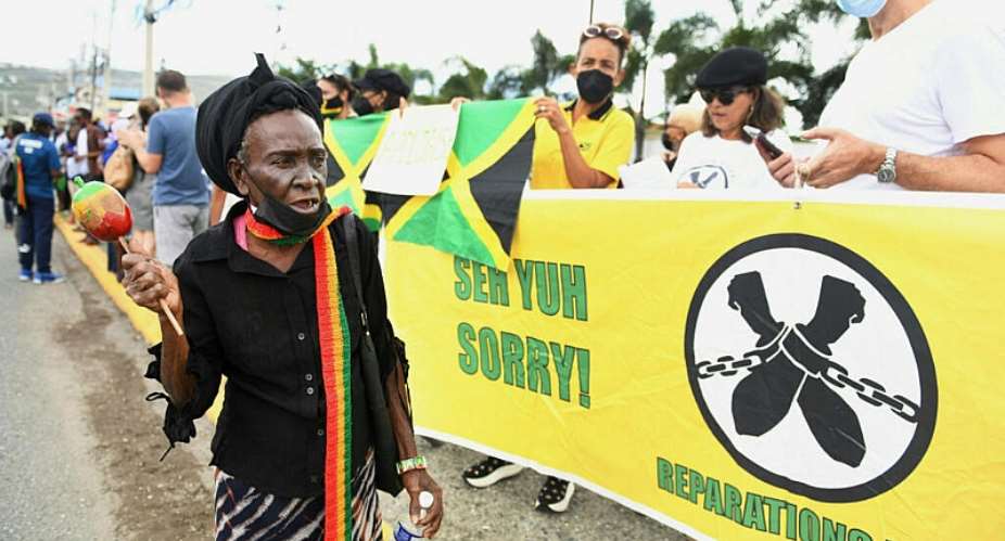 People calling for slavery reparations protest outside the British High Commission during a visit by the Duke and Duchess of Cambridge in Kingston, Jamaica, on 22 March 2022. - AFP - RICARDO MAKYN