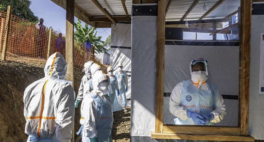 Health workers stand in a new Ebola treatment centre in Bunia, DR Congo. -  Glody Murhabazi, AFP
