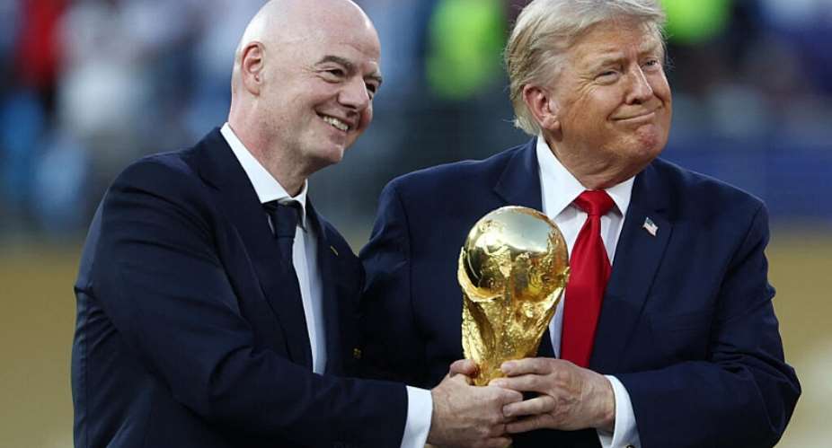 US President Donald Trump and FIFA President Gianni Infantino hold the World Cup trophy. -  Mark J Rebilas, Reuters