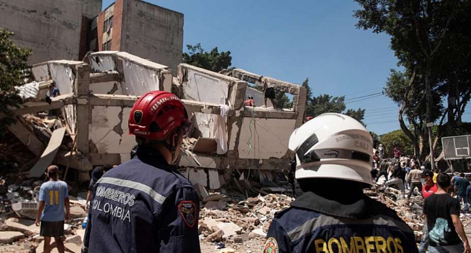 Emergency personnel work at the site of a damaged building after an earthquake in Cali, Colombia, on August 10, 2026. -  Christian EscobarMora, Reuters