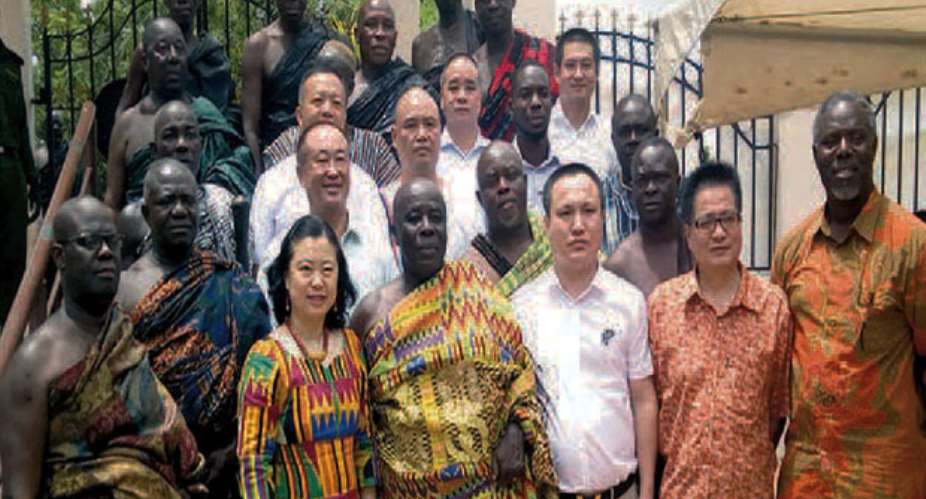 The Okyenhene in a pose with the Chinese Ambassador