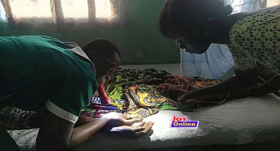 Maternal healthcare crisis: midwives use flashlights in baby delivery