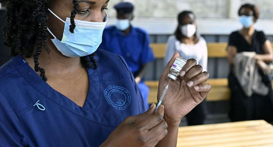 A health worker at Mbagathi hospitalamp;39;s vaccination centre in Nairobi. - Source: Photo by Simon MainaAFP via Getty Images