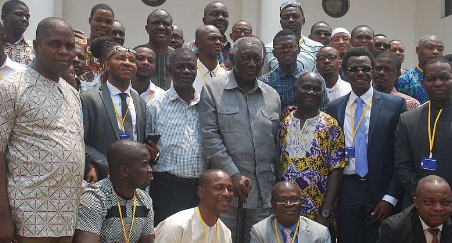 Former President Kufour takes a group photo with participants