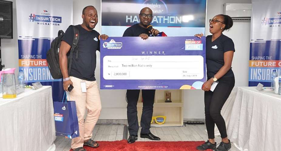 Team Lead, Team TopHill, Oni Joseph; Managing Director, Inlaks, Africa Operations, Femi Adeoti; and Team Member, Team Tophill, Omondia Vester, being presented the winning prize