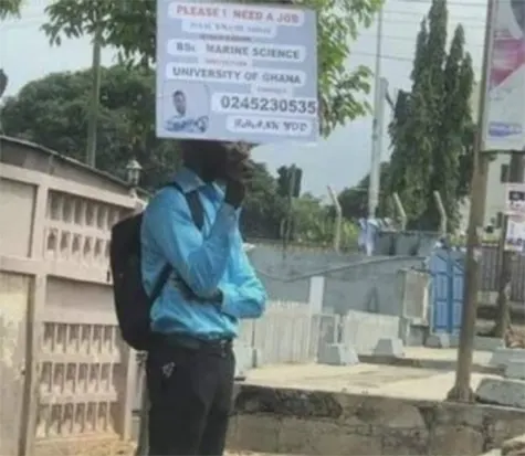 A graduate with a placard in search for a job