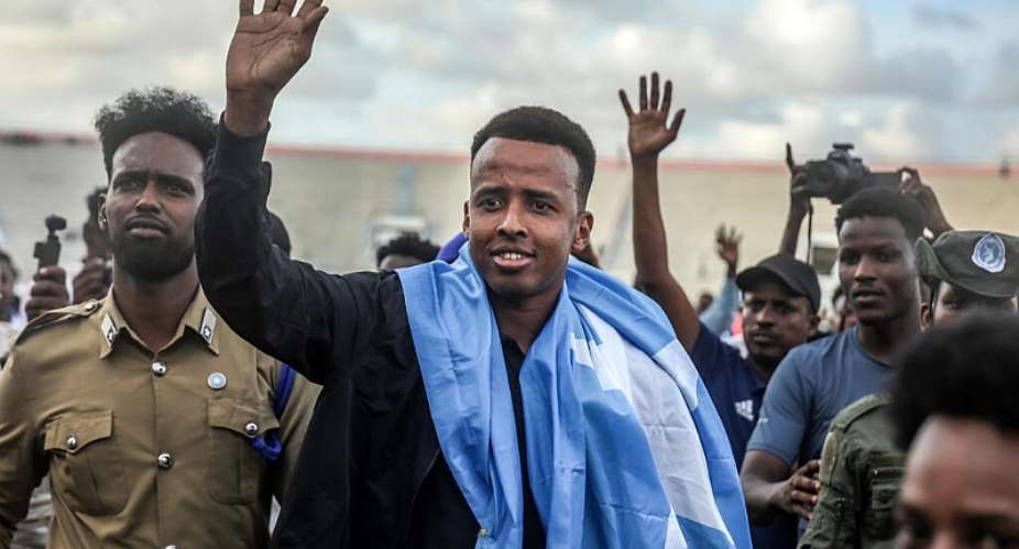 Before the World Cup started in June, Omar Artan (centre) unwittingly found himself in the media spotlight after being turned away on arrival at Miami International Airport. -  Hassan Ali Elmi, AFP file photo