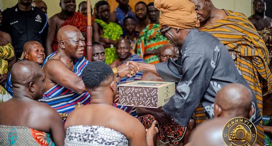 Kojo Antwi presents his new book to Otumfuo and Asantehemaa