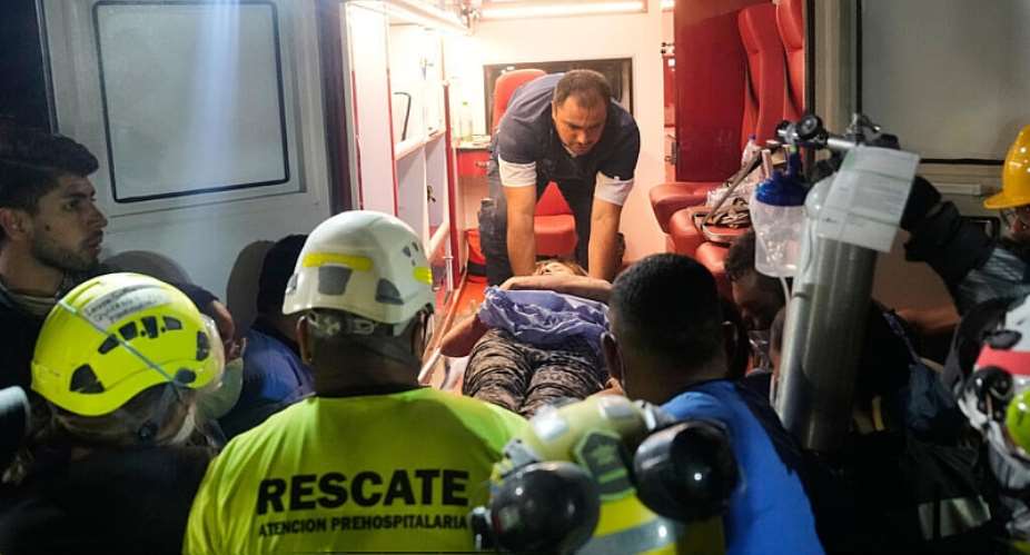Rescue workers carry survivor Daniela Largo after pulling her from the rubble the day after an earthquake struck Pereira, Colombia, on August 11, 2026. -  Fernando Vergara, AP