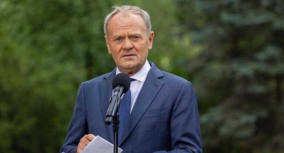 Polish Prime Minister Donald Tusk addresses the press during a press conference held in the gardens of the Prime Ministers Office in Warsaw on July 3, 2026. -  Wojtek Radwanski, AFP