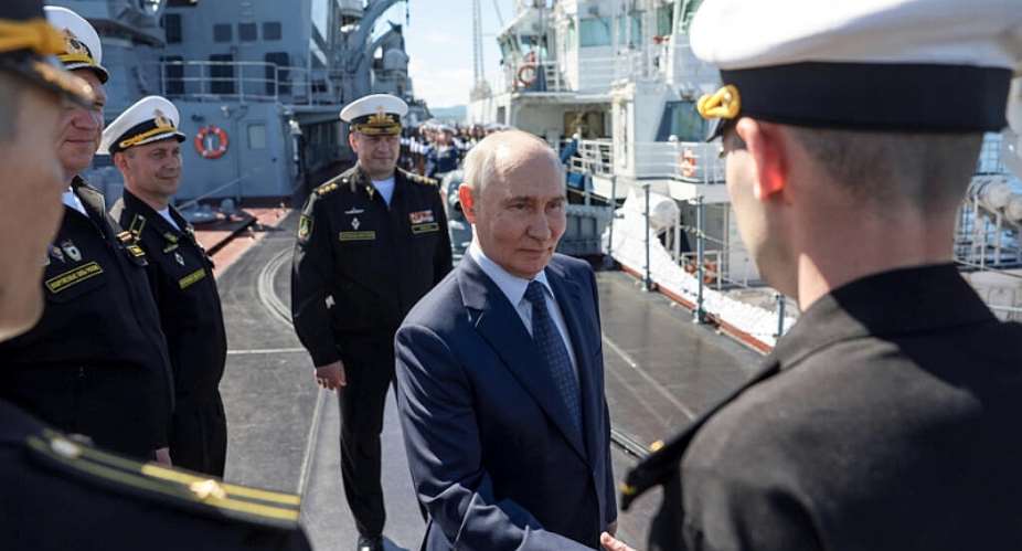 Pool photograph distributed by the Russian state agency Sputnik, President Vladimir Putin greets officers onboard the Russian Navys guided missile cruiser Varyag on far eastern Sakhalin Island on August 13, 2026. -  Gavriil Grigorov, AFP (Pool)
