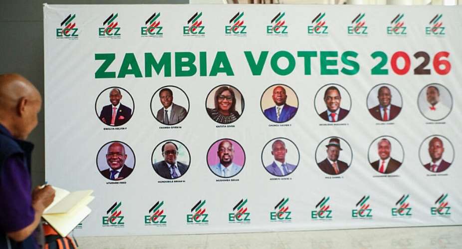 A person writes down names from a banner displaying candidates for Zambias 2026 general election at the Mulungushi International Conference Centre ahead of the countrys general election on August 13, in Lusaka, Zambia, August 12, 2026. - REUTERS - Jean Mandela
