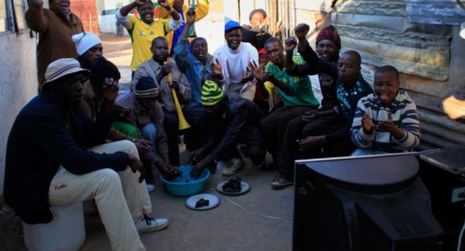South African Football Fans Cheer On From Home