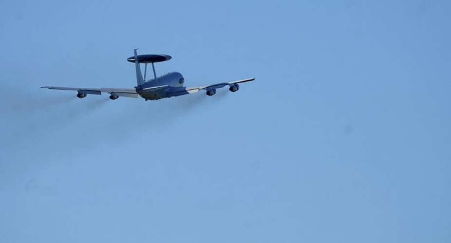 File photo: A NATO Airborne Warning and Control System (AWACS) surveillance plane flies over a military air base in Latvia. -  Ints Kalnins, Reuters