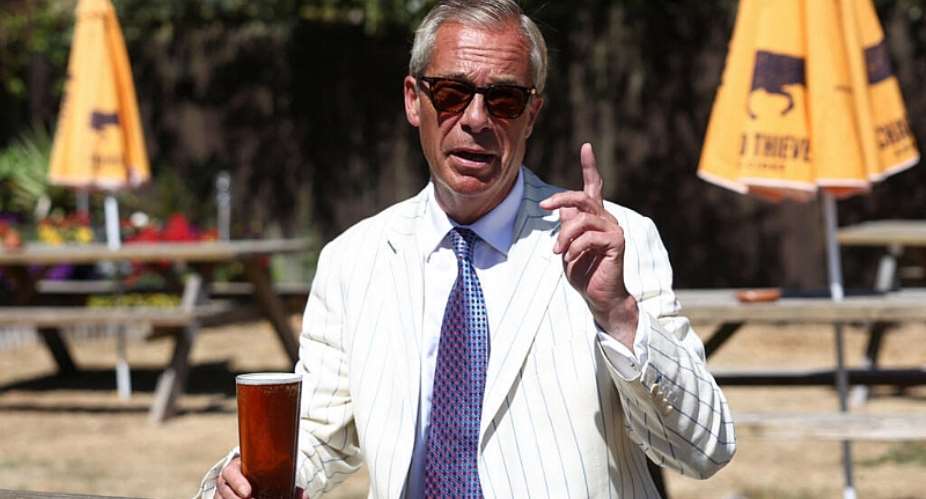 Reform UK party leader Nigel Farage drinks a pint on the day of voting in the Clacton by-election triggered by his own resignation. -  Toby Shepheard, Reuters