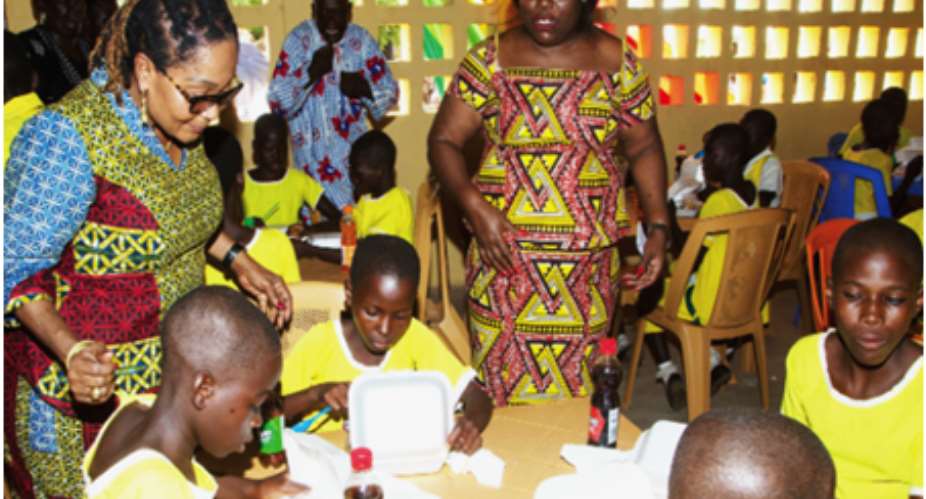 Mrs Lordina Mahama and Nana Oye Lithur, the Minister of Women, Gender and Social Protection, interacting with the children in the dining hall